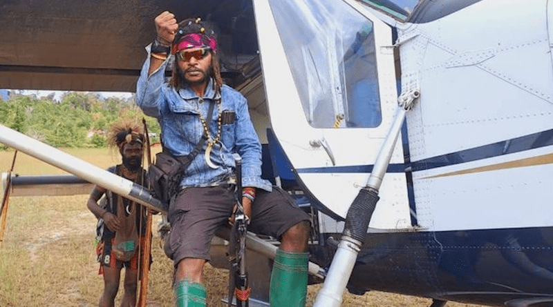 Egianus Kogoya gestures while sitting on a captured Susi Air plane in the central highlands of Indonesia’s Papua region, Feb. 7, 2023. Handout photo/West Papua National Liberation Army.
