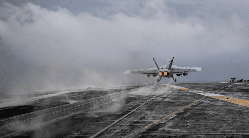 An F/A-18F Super Hornet from the “Fighting Redcocks” of Strike Fighter Squadron (VFA) 22 launches from the flight deck of the aircraft carrier USS Nimitz (CVN 68). U.S. Navy photo by Mass Communication Specialist 2nd Class David Rowe