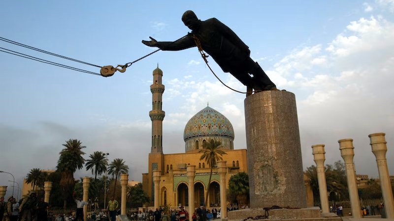 The statue of Iraq's Saddam Hussein topples in Baghdad's Firdos Square on April 9, 2003. Photo Credit: DOD