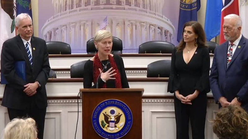 Representative Deborah Ross (D-NC) speaking with other members of the House of Representatives at presentation of H. Res. 100 (photo supplied)