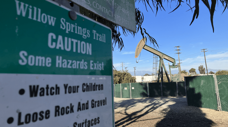 An oil well located next to a city park in Signal Hill, California. A new study finds Californians living near active oil and gas wells are disproportionately Black, Latinx and low-income. Living within 1 kilometer of active wells can expose people to higher levels of pollution and contribute to a variety of health problems. CREDIT: UC Berkeley photo by David González