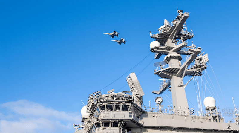 EA-18G Growler jets, assigned to the Navy’s “Gauntlets” of Electronic Attack Squadron 136, fly over the aircraft carrier USS Carl Vinson in the Pacific Ocean, March 26, 2023. Photo Credit: Navy Petty Officer 3rd Class Leon Vonguyen