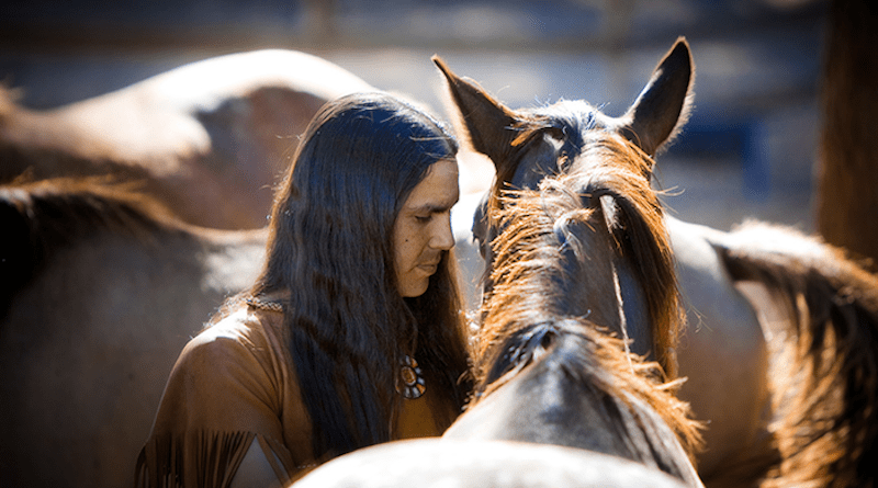 Man, “He Stalks One”, and horse connect. CREDIT: © Sacred Way Sanctuary