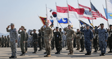 Service members display flags of participating nations during the Cobra Gold 2023 opening ceremony at U-Tapao Air Base in Rayong province, Thailand, Feb. 28, 2023. U.S. Army National Guard photo/Staff Sgt. Adeline Witherspoon