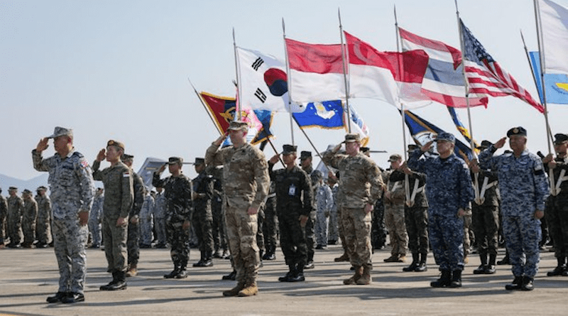 Service members display flags of participating nations during the Cobra Gold 2023 opening ceremony at U-Tapao Air Base in Rayong province, Thailand, Feb. 28, 2023. U.S. Army National Guard photo/Staff Sgt. Adeline Witherspoon