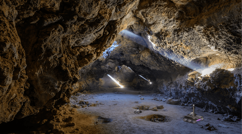 In this artist's impression of the breadcrumb scenario, autonomous rovers can be seen exploring a lava tube after being deployed by a mother rover that remains at the entrance to maintain contact with an orbiter or a blimp. CREDIT John Fowler/Creative Commons (photo), Mark Tarbell and Wolfgang Fink/University of Arizona