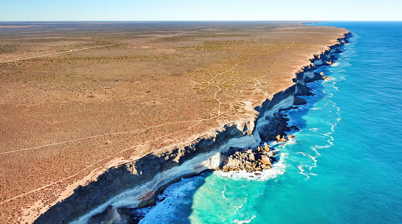 Drone image of the Bunda Cliffs, where the Nullarbor Plain meets the Great Australian Bight. Layering in the cliffs represent different limestone units. CREDIT: Photo courtesy of Dr Matej Lipar.