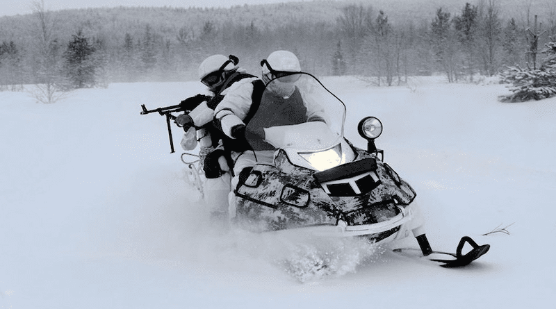 File photo of Russian Arctic Brigade soldiers riding a snowmobile. Photo Credit. Mil.ru