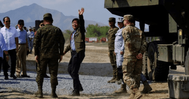 Philippine President Ferdinand Marcos Jr. waves after inspecting a weapons system at a military base in San Antonio, Zambales province, Philippines, April 26, 2023. Photo Credit: Jason Gutierrez/BenarNews