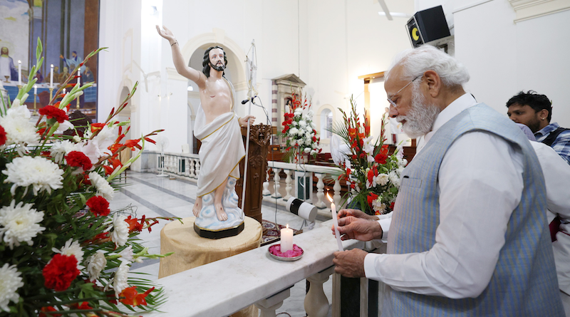 India's PM Narendra Modi lighting a candle at Delhi's Sacred Heart Cathedral Catholic Church on the occasion of Easter, in New Delhi on April 9, 2023. Photo Credit: PM India Office