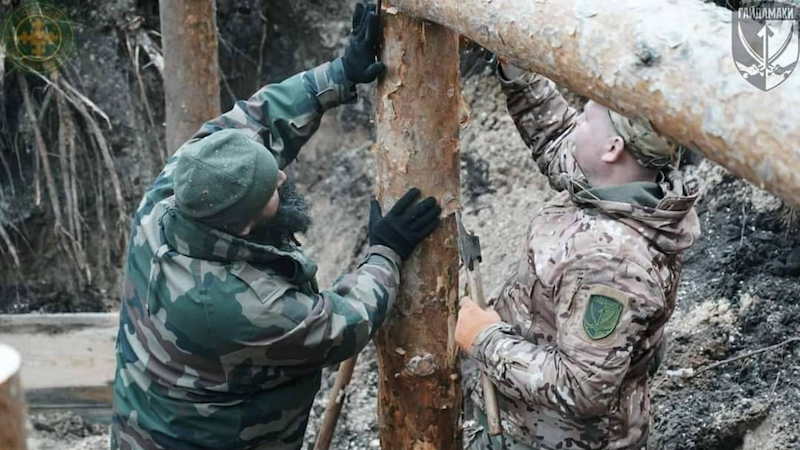 Ukrainian soldiers building a trench. Photo Credit: Ukraine Defense Ministry