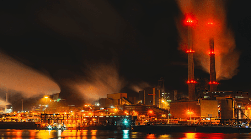 Factory at night. Photo Credit: Floris Andrea at Unsplash