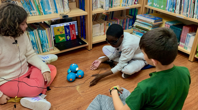 Children with mixed visual impairment having a group conversation moderated by the robot Dash