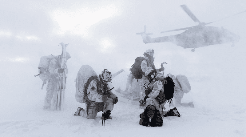 U.S. Army Green Berets with 10th Special Forces Group (Airborne) prepare to load into a Finnish Army NH90 transport helicopter assigned to Utti Jaeger Regiment atop a frozen lake in Lapland, Finland. (U.S. Army photo by Staff Sgt. Anthony Bryant)