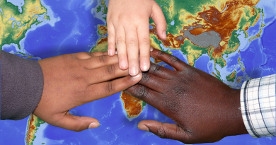 hands globe peace children migrants immigration