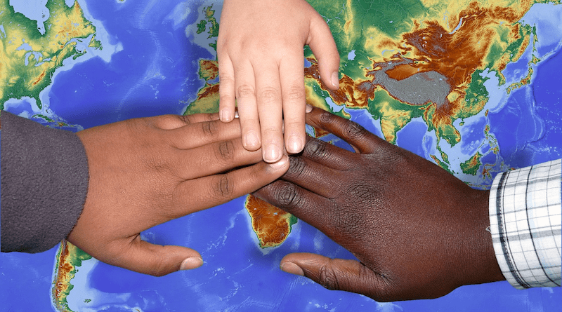 hands globe peace children migrants immigration