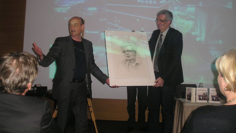 ©Copyright Sabahudin Hadžialić. Receiving a portrait of himself by the side of Slovenian artist Tadej Zugman, Ljubljana, Slovenia, 2014. During the promotion of his novel in Ljubljana.