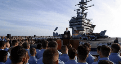 President George W. Bush addresses sailors and the nation from the flight deck of the USS Abraham Lincoln of the coast of San Diego, California May 1, 2003. White House photo by Paul Morse