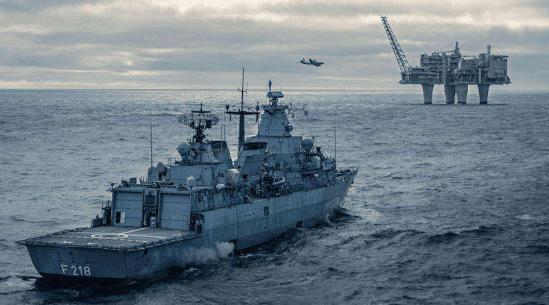 NATO member ship patrols near oil platform. Photo Credit: NATO