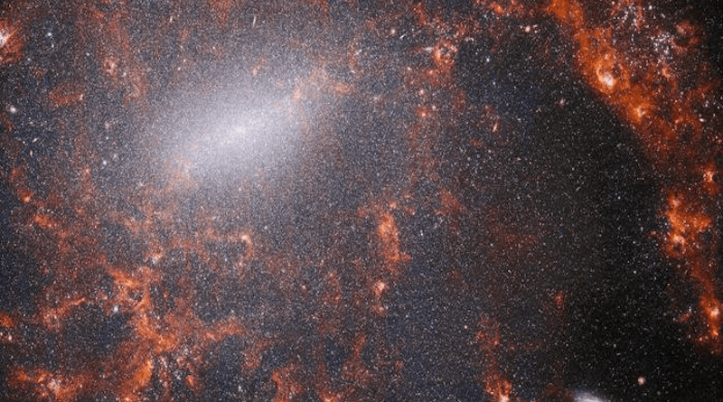 This view of the barred spiral galaxy NGC 5068, from the James Webb Space Telescope’s NIRCam instrument, is studded by the galaxy’s massive population of stars, most dense along its bright central bar, along with burning red clouds of gas illuminated by young stars within. This near-infrared image of the galaxy is filled by the enormous gathering of older stars which make up the core of NGC 5068. The keen vision of NIRCam allows astronomers to peer through the galaxy’s gas and dust to closely examine its stars. Dense and bright clouds of dust lie along the path of the spiral arms: These are H II regions, collections of hydrogen gas where new stars are forming. The young, energetic stars ionize the hydrogen around them, creating this glow represented in red. Credits: ESA/Webb, NASA & CSA, J. Lee and the PHANGS-JWST Team