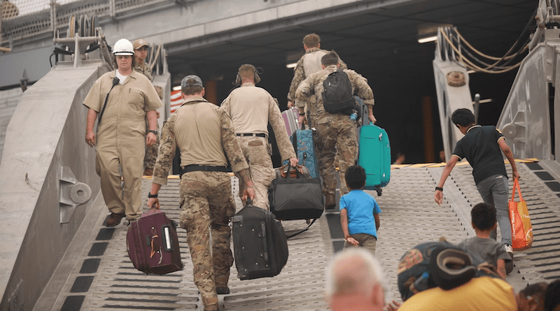 U.S. citizens and others who have requested departure from Sudan board the Military Sealift Command expeditionary fast transport ship USNS Brunswick (T-EPF 6) while it moors in Port Sudan, April 30, 2023. Photo Credit: Africom Pay