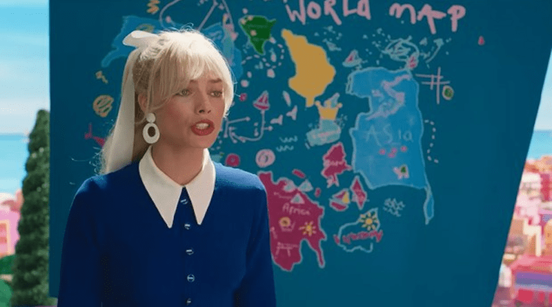 Margot Robbie, star of the film “Barbie,” stands in front of the map that caused the Vietnamese government to ban the film. The part of the map that led to the ban is to the right of Robbie and has eight dashes off the shore of a large landmass labeled "Asia." Credit: Screenshot from Warner Bros Pictures “Barbie” video