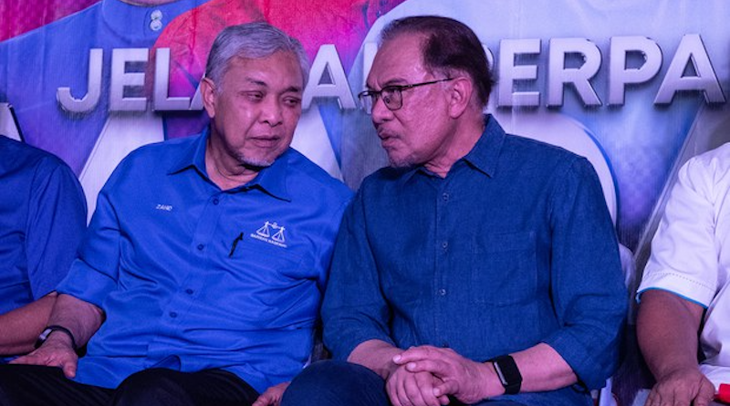 Malaysia's Prime Minister Anwar Ibrahim (right) listens to his deputy, Ahmad Zahid Hamidi, at an event in Selangor, Malaysia, July 7, 2023. [BenarNews/S. Mahfuz]