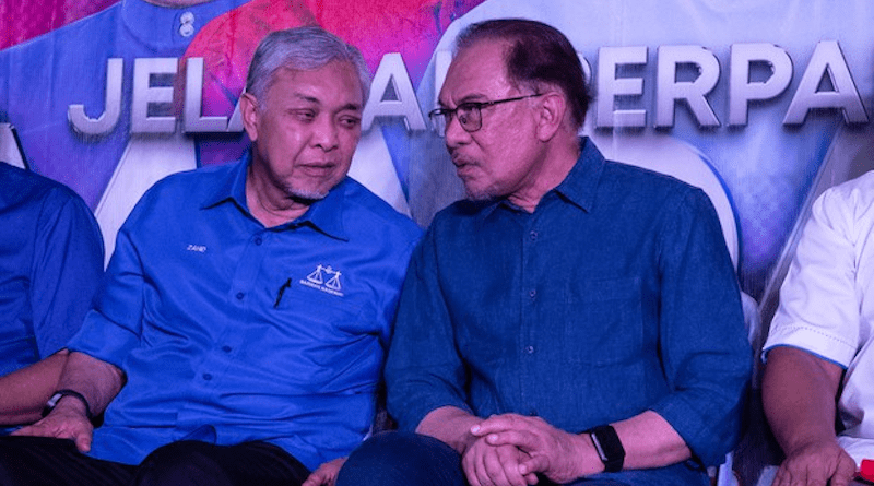 Malaysia's Prime Minister Anwar Ibrahim (right) listens to his deputy, Ahmad Zahid Hamidi, at an event in Selangor, Malaysia, July 7, 2023. [BenarNews/S. Mahfuz]