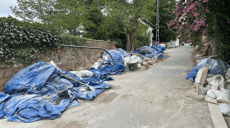 Construction remnants, rubble piles, sand, stones, and cement on the street near the Taş Mektep house in Prinkipo. Photo Credit: Haluk Direskeneli