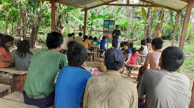 A health educator conveys information about COVID-19 transmission to members of Bolivia's Tsimané population CREDIT: Michael Gurven
