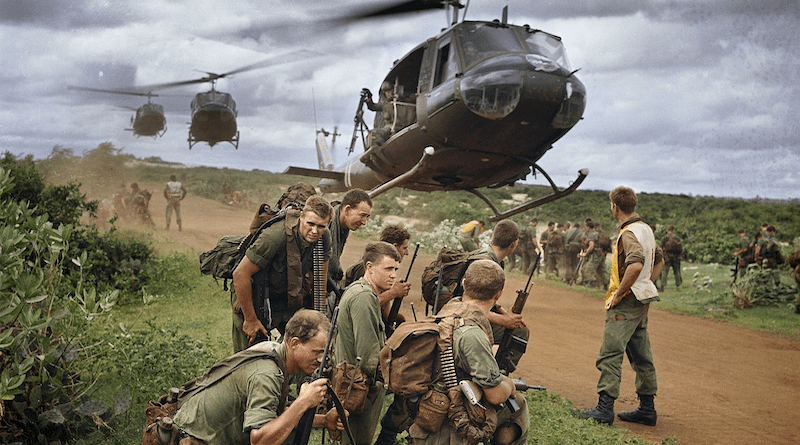 Australian soldiers from 7 RAR waiting to be picked up by US Army helicopters following a cordon and search operation near Phước Hải on 26 August 1967. Photo Credit: Michael Coleridge, Wikipedia Commons, photo cropped