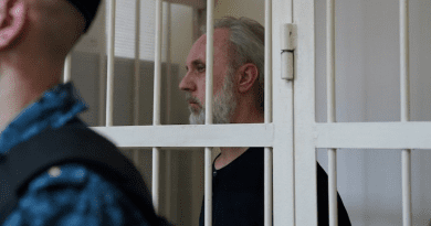 Fr Ioann Kurmoyarov in the defendant's cage, Kalinin District Court, St Petersburg Photo Credit: RFE/RL