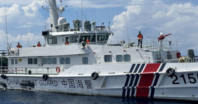 Crew members of a China Coast Guard ship are seen from the BRP Cabra, a Philippine Coast Guard ship, during an encounter in South China Sea (West Philippine Sea) waters near Ayungin (Second Thomas) Shoal, Sept. 8, 2023. Photo Credit: Camille Elemia/BenarNews