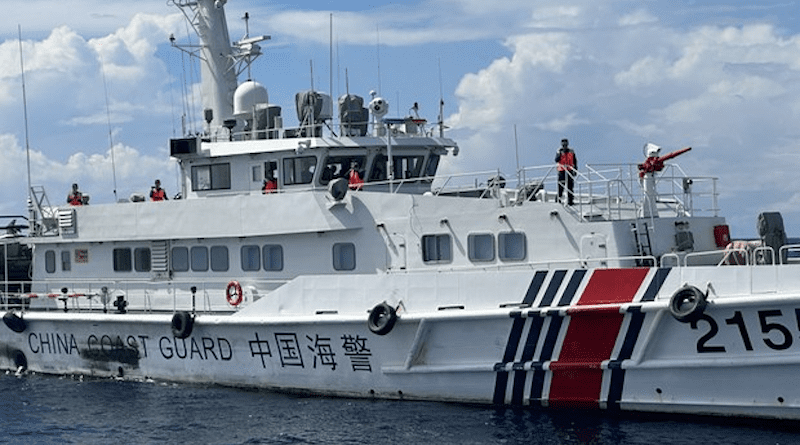 Crew members of a China Coast Guard ship are seen from the BRP Cabra, a Philippine Coast Guard ship, during an encounter in South China Sea (West Philippine Sea) waters near Ayungin (Second Thomas) Shoal, Sept. 8, 2023. Photo Credit: Camille Elemia/BenarNews