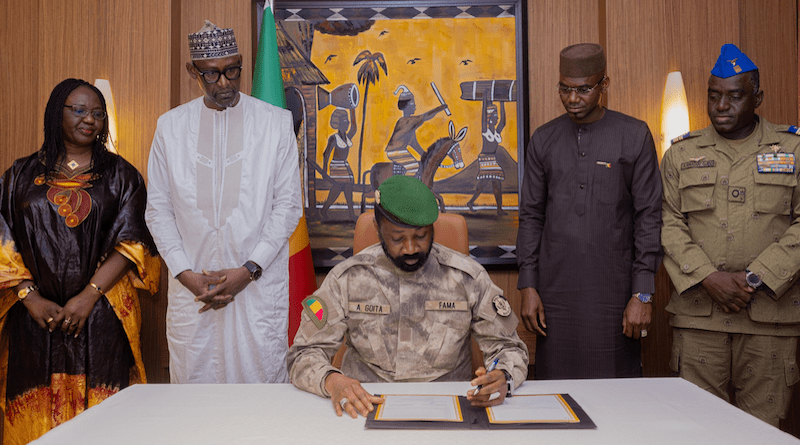 Mali's Colonel Assimi Goïta signs the Liptako-Gourma Charter which created the Alliance of Sahel States (AES). Photo Credit: Colonel Assimi Goïta, X