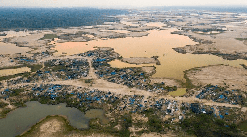 A former mining camp shows where shallow mining ponds have overwhelmed a former river system in the La Pampa region of Madre de Dios, Peru. CREDIT: Photo by Jason Houston (iLCP Redsecker Response Fund/CEES/CINCIA))