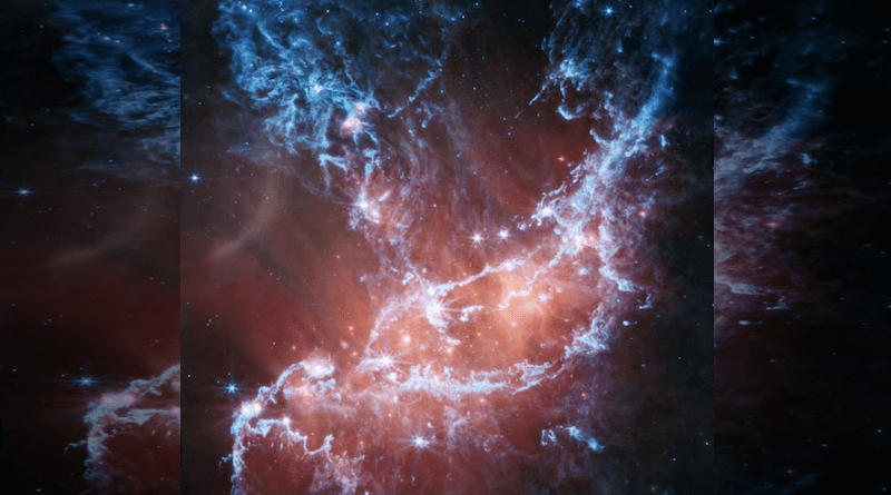 This new infrared image of NGC 346 from NASA’s James Webb Space Telescope’s Mid-Infrared Instrument (MIRI) traces emission from cool gas and dust. In this image blue represents silicates and sooty chemical molecules known as polycyclic aromatic hydrocarbons, or PAHs. More diffuse red emission shines from warm dust heated by the brightest and most massive stars in the heart of the region. Bright patches and filaments mark areas with abundant numbers of protostars. This image includes 7.7-micron light shown in blue, 10 microns in cyan, 11.3 microns in green, 15 microns in yellow, and 21 microns in red (770W, 1000W, 1130W, 1500W, and 2100W filters, respectively). CREDIT Credit: NASA, ESA, CSA, STScI, N. Habel (JPL). Image Processing: P. Kavanagh (Maynooth University)