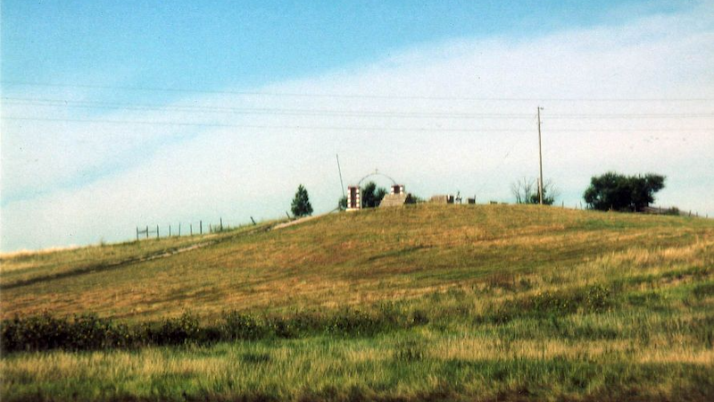 Wounded Knee, Pine Ridge Reservation, South Dakota, USA. Entrance gate to cemetery. Photo Credit: Napa, Wikipedia Commons