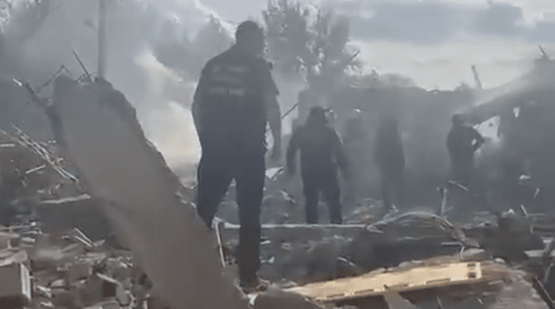 Emergency workers search the victims of the deadly Russian rocket attack that killed more than 50 people in the village of Hroza near Kharkiv, Ukraine. Photo Credit: Ukraine Defense Ministry video screenshot