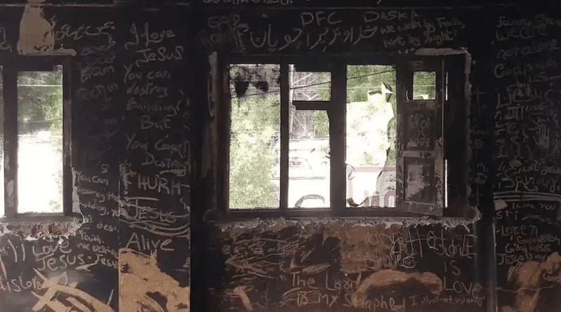 Messages for Christians are written on the ash-covered wall of the Salvation Army Church in Jaranwala, a Christian settlement in Pakistan's Punjab province, where at least 19 churches were destroyed on Aug. 16 during an anti-Christian violence. (Photo: Kamran Chaudhry)