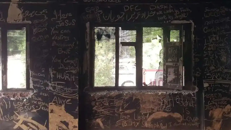 Messages for Christians are written on the ash-covered wall of the Salvation Army Church in Jaranwala, a Christian settlement in Pakistan's Punjab province, where at least 19 churches were destroyed on Aug. 16 during an anti-Christian violence. (Photo: Kamran Chaudhry)