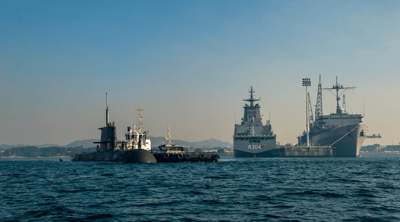 The Royal Australian Navy Collins-class submarine HMAS Farncomb (SSG 74) prepares to moor alongside the Emory S. Land-class submarine tender USS Frank Cable (AS 40) at HMAS Stirling Navy Base, April 19, 2022. Frank Cable is currently on patrol conducting expeditionary maintenance and logistics in support of national security in the U.S. 7th Fleet area of operations. (U.S. Navy photo by Mass Communication Specialist Seaman Wendy Arauz/Released)