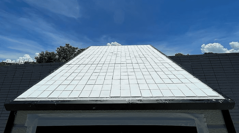 Application in a building envelope, with the white cooling ceramic applied on the roof. CREDIT: City University of Hong Kong