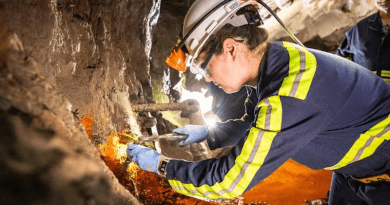 Prof. Magdalena Osburn removes a sample during a site visit in August. CREDIT: Sanford Underground Research Facility