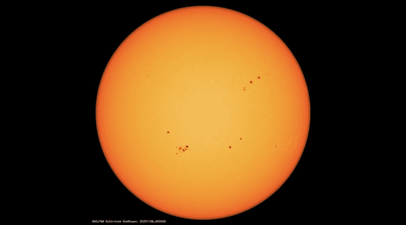 Image from the Solar Dynamics Observatory mission of the solar disk with multiple sunspots, which appear dark compared with their surroundings. CREDIT: HMI/SDO/NASA