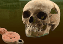 This image shows the skull of the East African individual plus the oil lamp with the legionary eagle that he was buried with. CREDIT: Miodrag Grbic