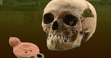 This image shows the skull of the East African individual plus the oil lamp with the legionary eagle that he was buried with. CREDIT: Miodrag Grbic