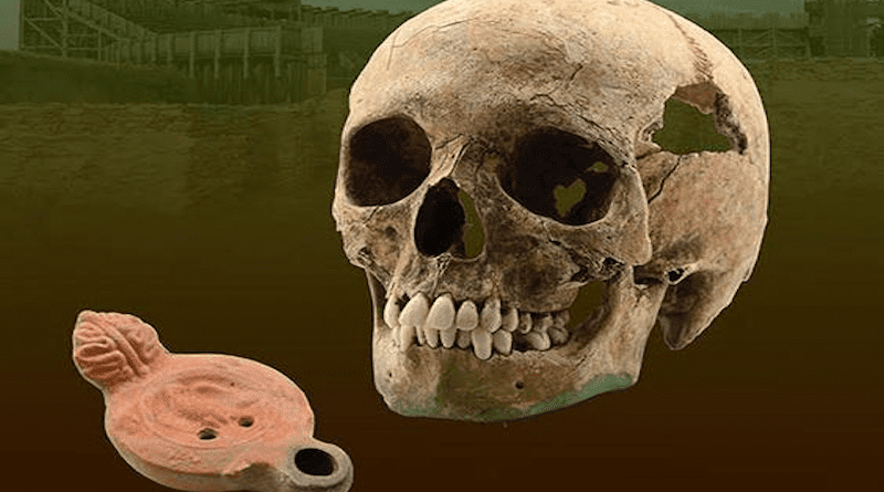 This image shows the skull of the East African individual plus the oil lamp with the legionary eagle that he was buried with. CREDIT: Miodrag Grbic