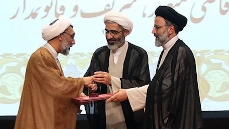 Ebrahim Raisi (right) and Mostafa Pourmohammadi (left), two members of Iran's "Judges of Death" committee. Photo Credit: Tasnim News Agency