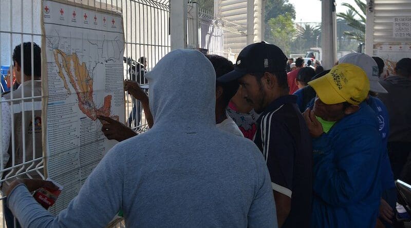 Migrants looking for routes on a map of Mexico. Photo Credit: ProtoplasmaKid, Wikipedia Commons